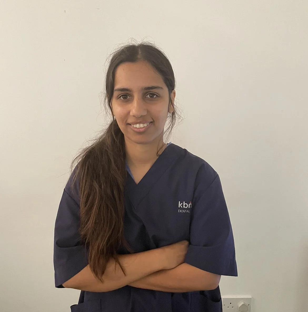 A KBM Dental clinician smiling in the clinic
